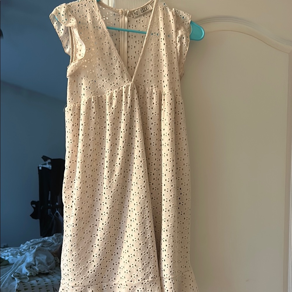 Elle Cream Babydoll Dress with Knee-Length Flutter Sleeves and V-Neck